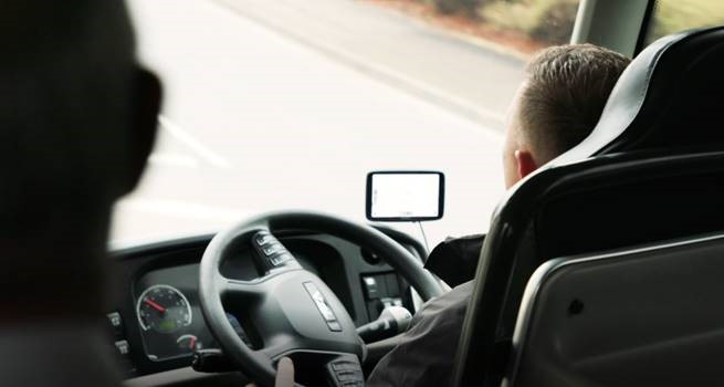 Driver behind wheel