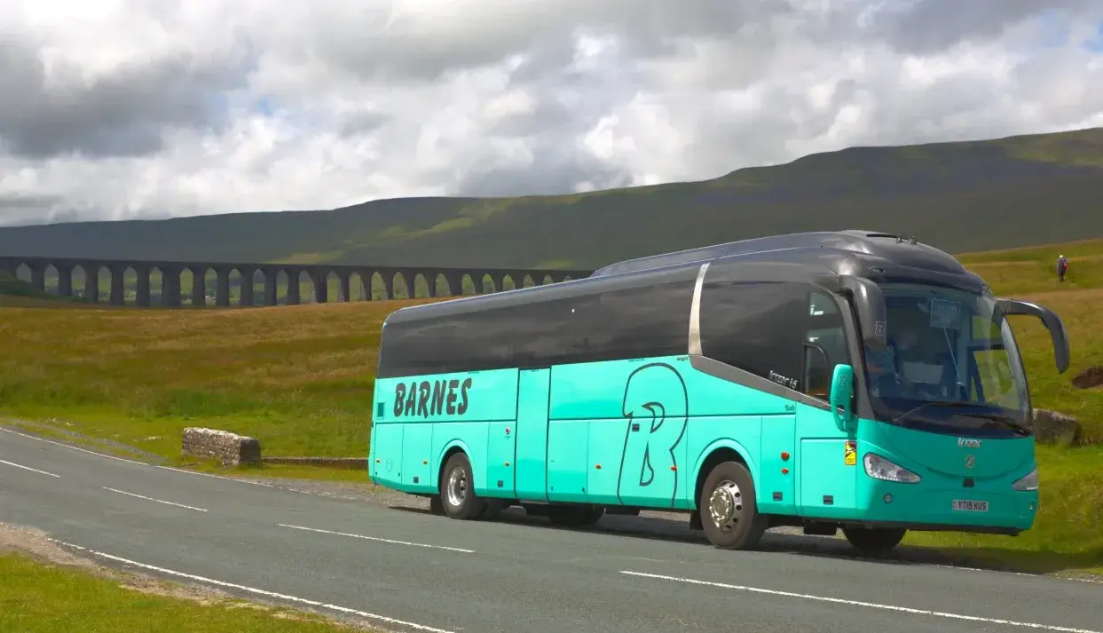 Coach parked by hills