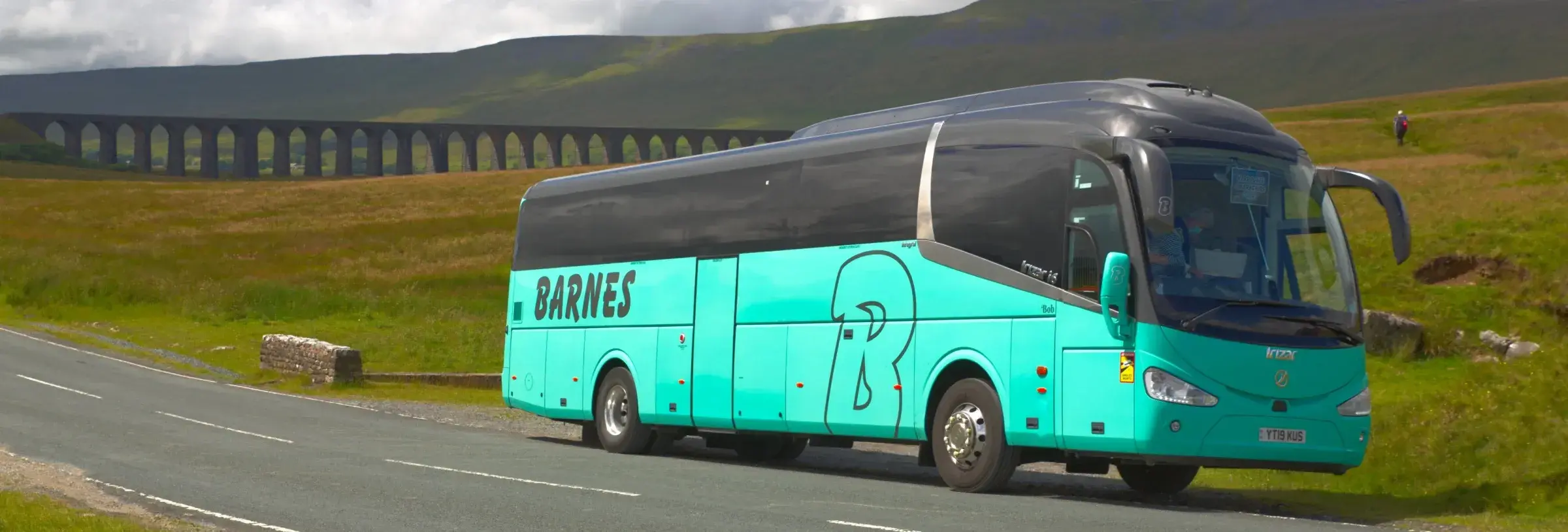 Coach parked by hills