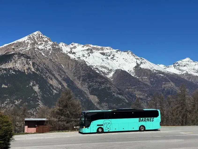 Barnes coach parked by mountains